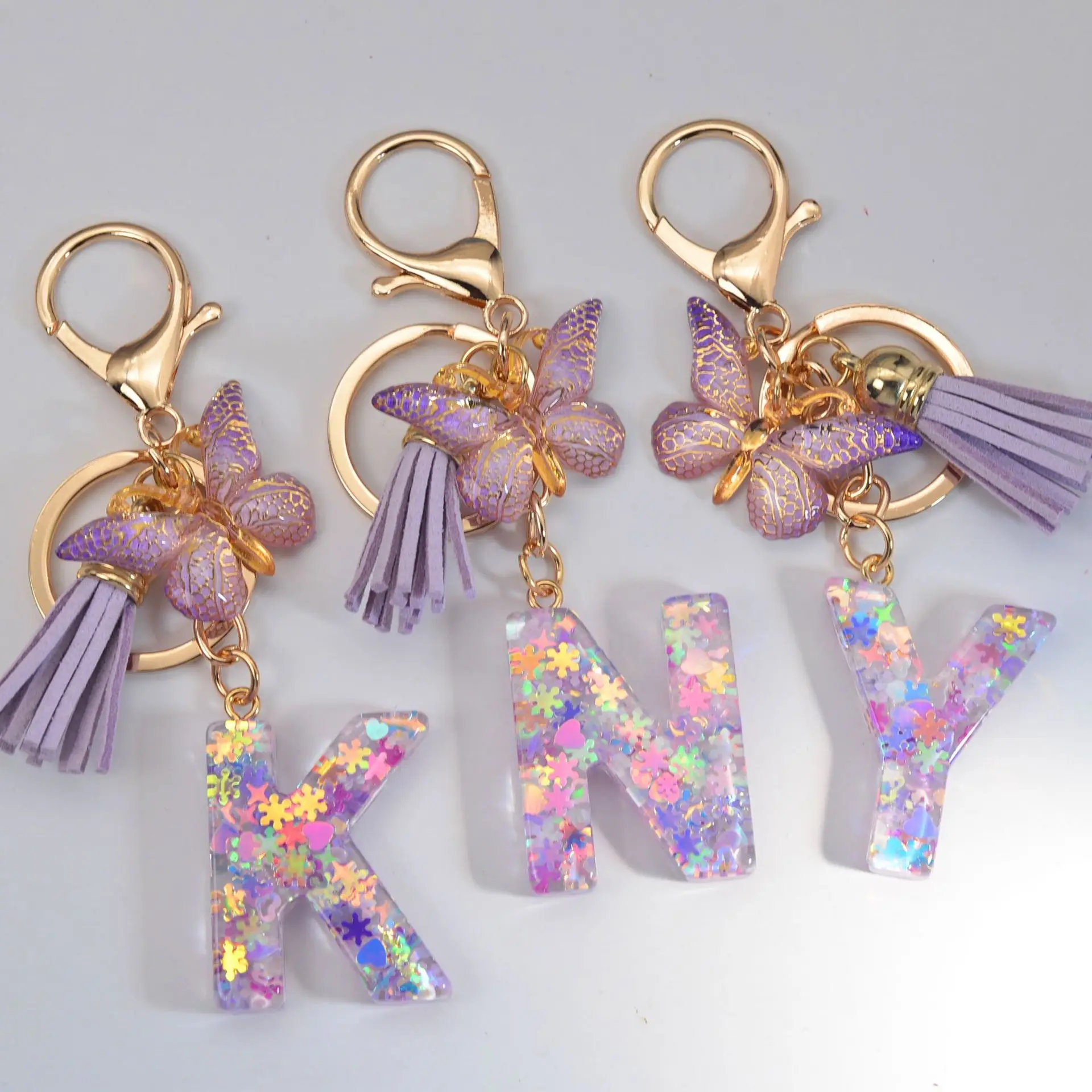 Hot selling New snowflake sequin crystal epoxy English letter keychain men and women bag gift pendant keychain