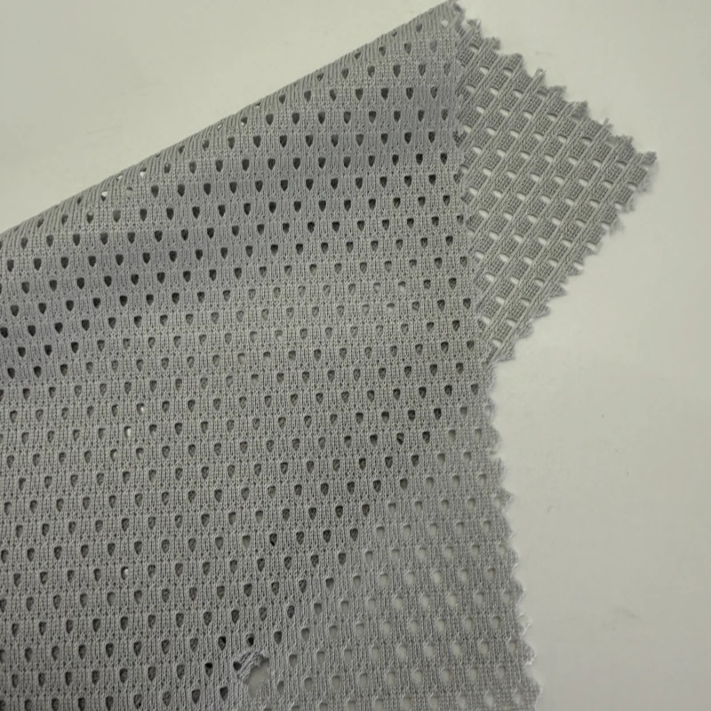 China Factory Direct Sale 24 Colours In Stock Knitted Fabric 120gsm Tri-angle Peach  Mesh Fabric for Cloth Use