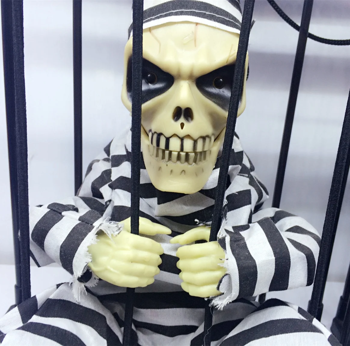 Halloween Trick Light-Controlled Induction Skull Prison Cage Ghost Funny Eyes Light-Emitting Party Electric Toy Ghost Scary Doll