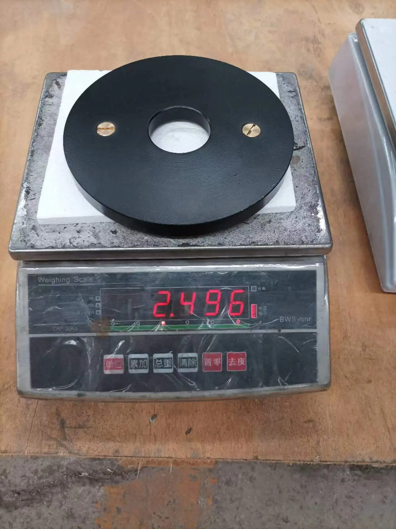 Calibrated steel power lifting barbell weight plates