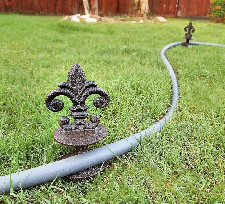 Antique Black Cast Iron Garden Strong and Decorative Hose Guide that Protects Your Plants and Provides Elegance to Your Garden