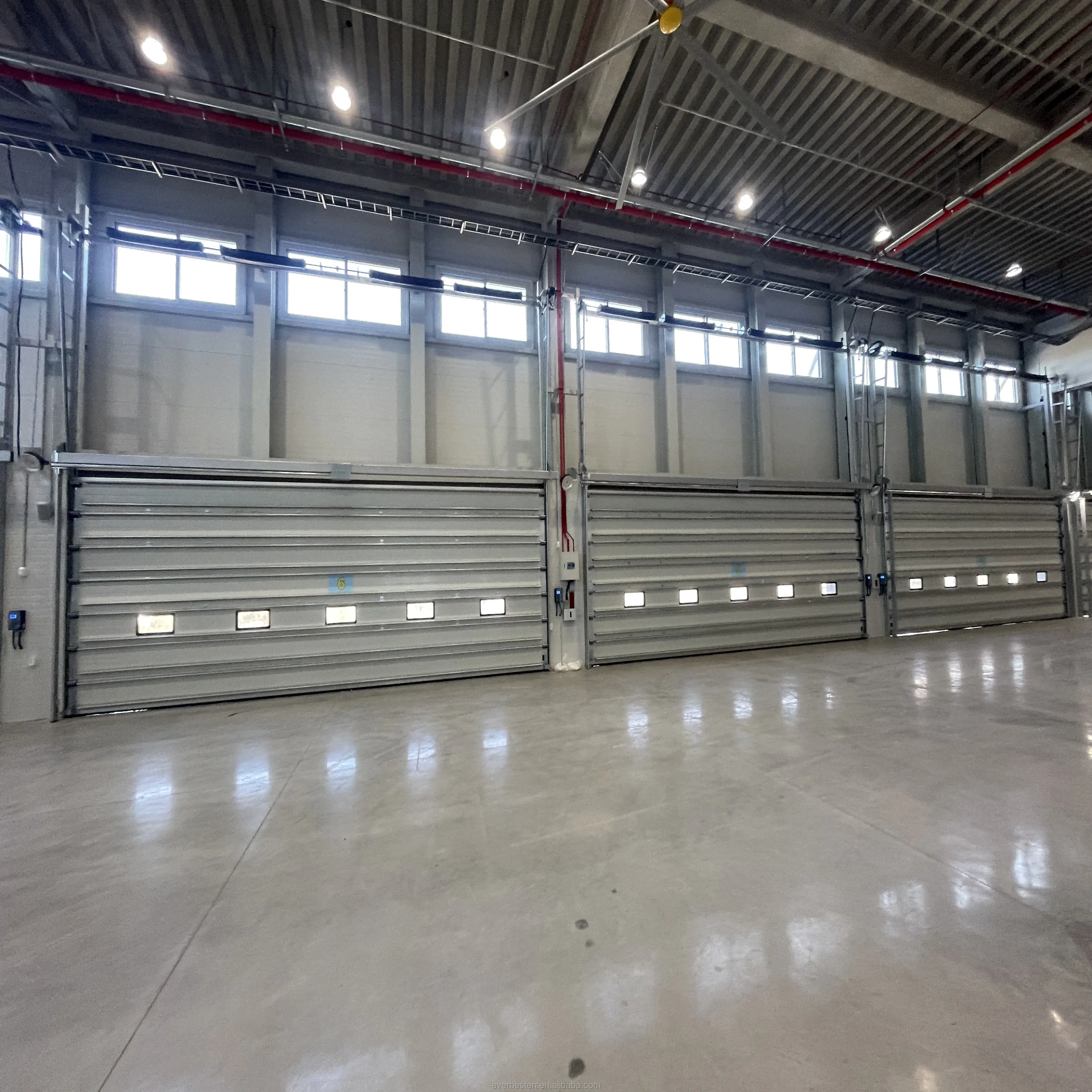 China Good Quality Vertical Overhead Electric Warehouse Industrial Sectional lifting Door