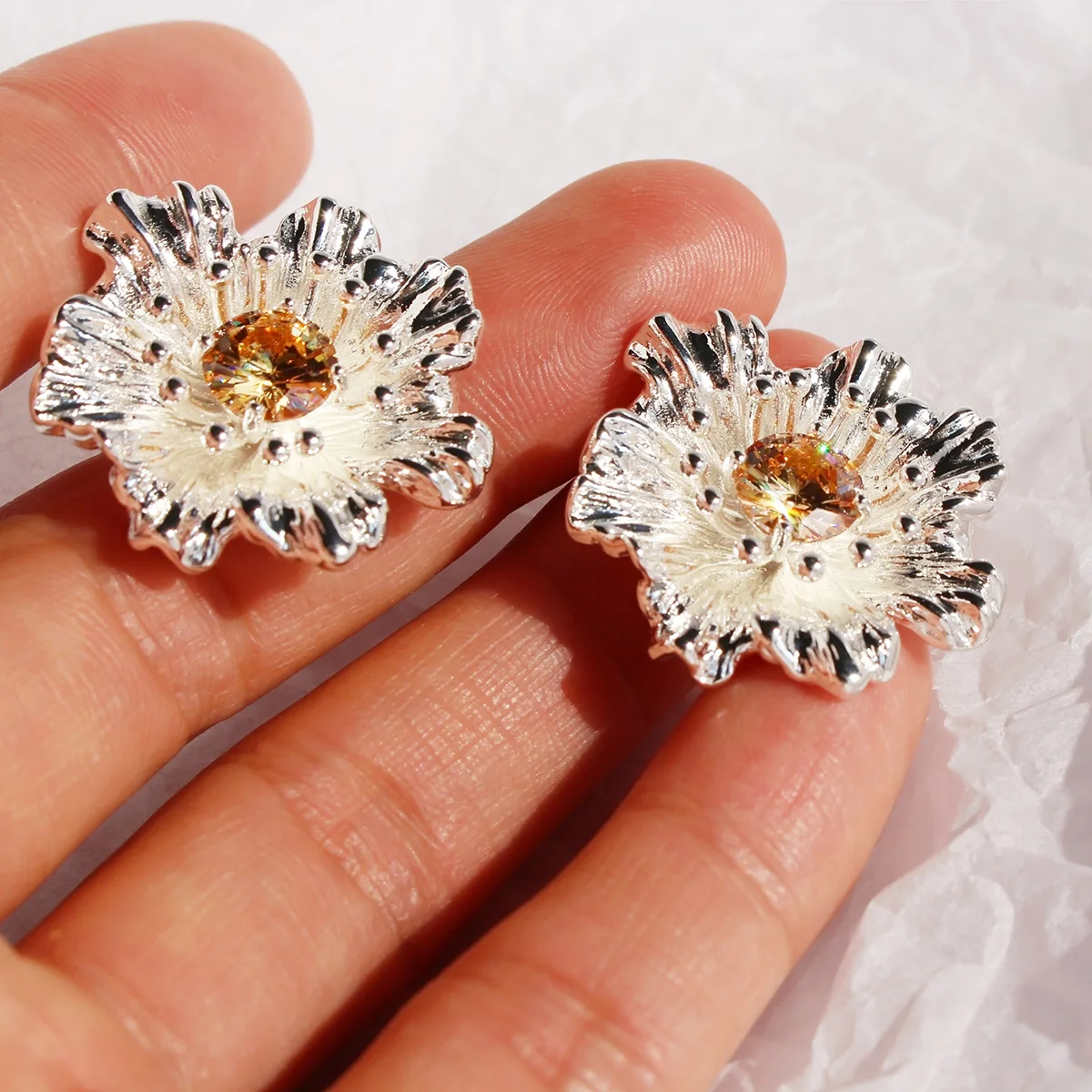 Copper plated real gold small cold silver three-dimensional flower earrings inset purple zircon exaggerated earrings 102