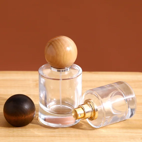 30/50/100ml Clear Glass Perfume Bottle Aroma Fragrance Pump Spray Empty Cylinder Glass Bottle With Cute Wood Ball Shape Cap