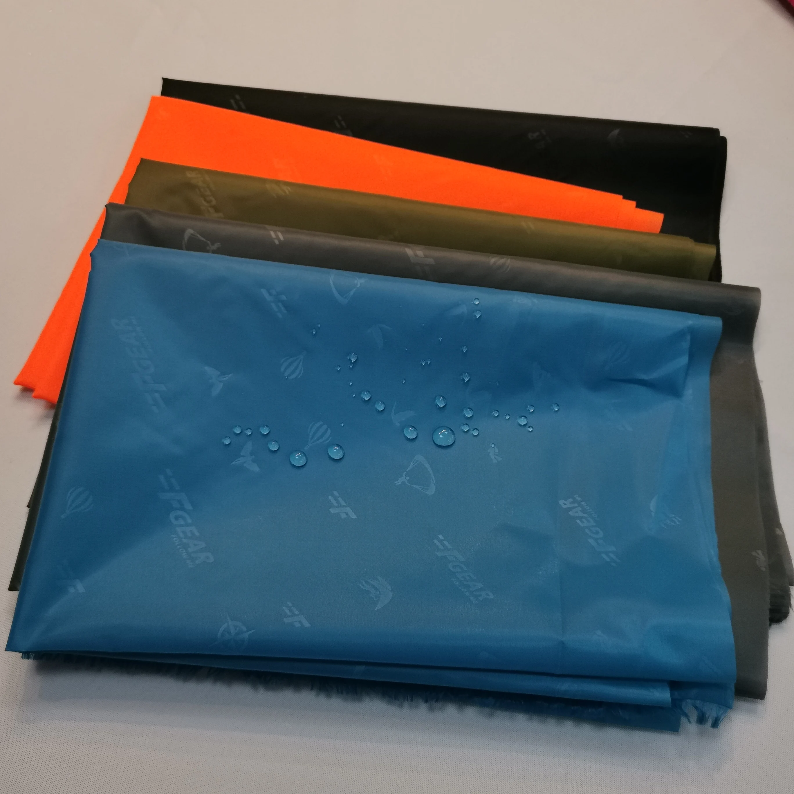 High quality woven jersey polyester jacquard with twill taffeta embossed red-crowned crane logo jacquard lining