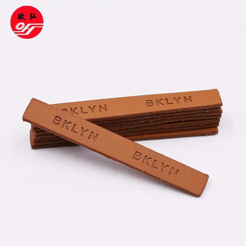 
Good Style Customized Debossed Brand Name Brown PU Leather Badge Patch for Clothing 