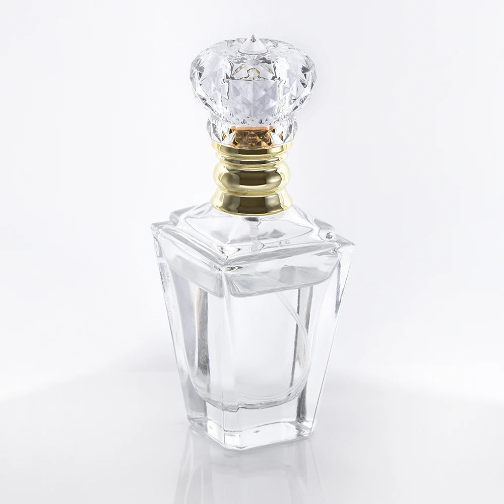 Luxury 60ml Abnormity shape glass press pump bottle for perfume with Crown Crystal topper and gold pump