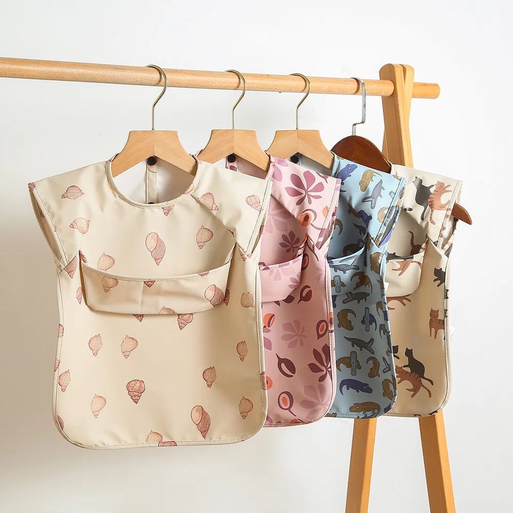 TikTOK Custom Printed Solid Baby Bib Waterproof Solid Print PU Feeding Bib with Pocket short Sleeve Child Apron Smock