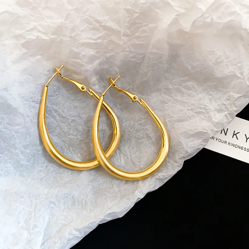 Gold electroplated silver needle oval metal hoop earrings for women cold wind personality fashion everything with