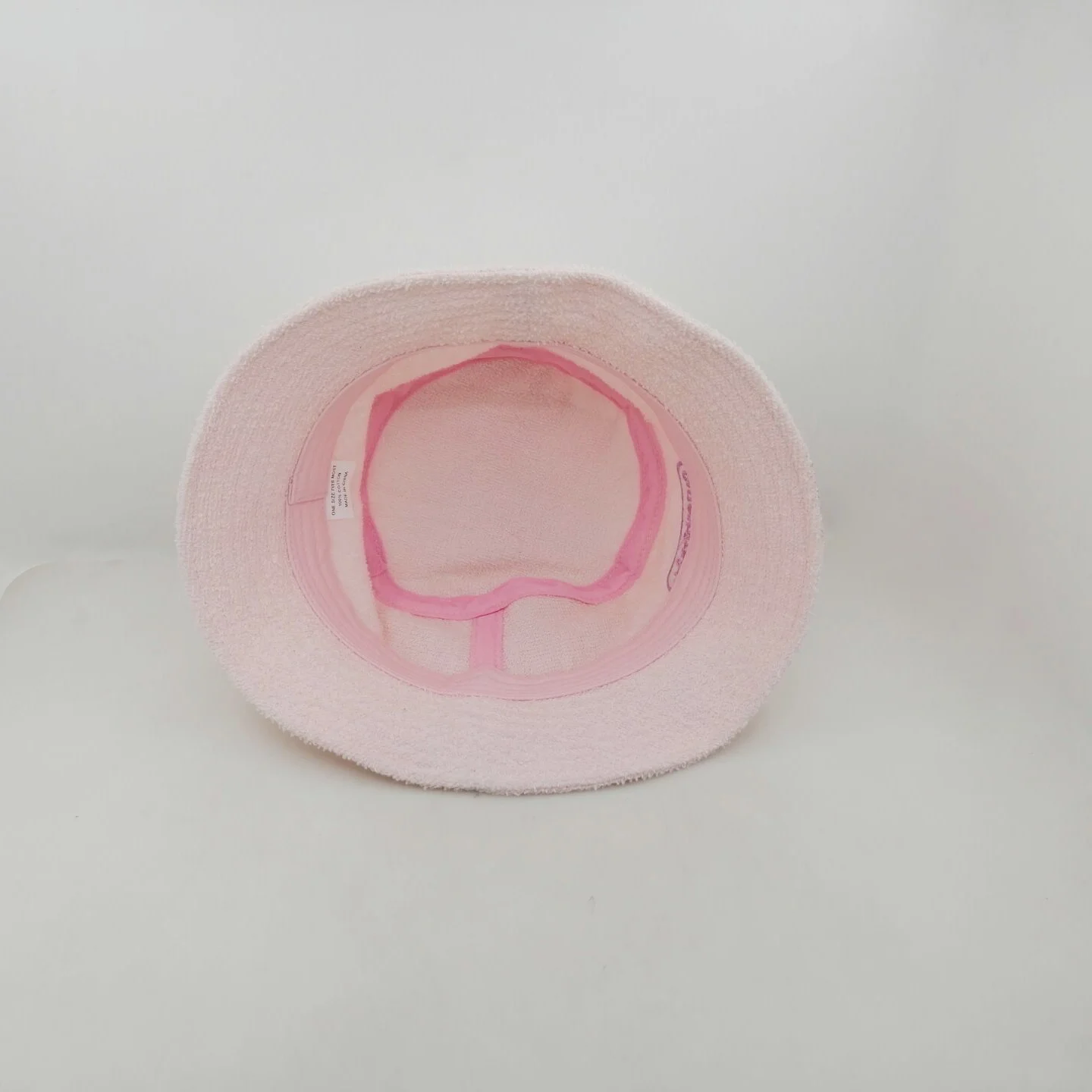 Custom lighter pink terry towel bucket hats with front embroidery