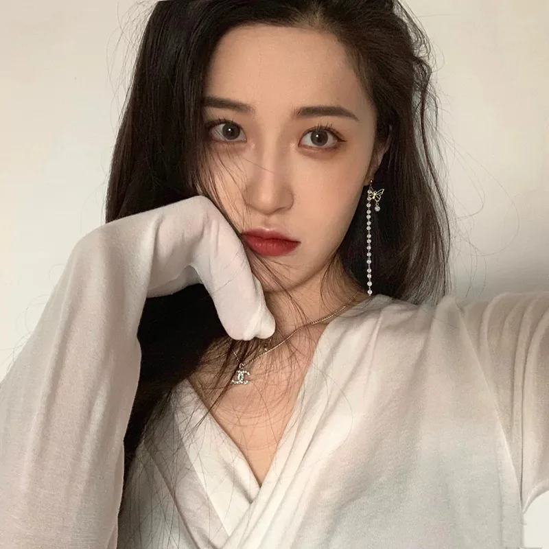 Han Jue jewelry factory thin Bow Earrings female long style asymmetric tassel high sense Korean Earrings