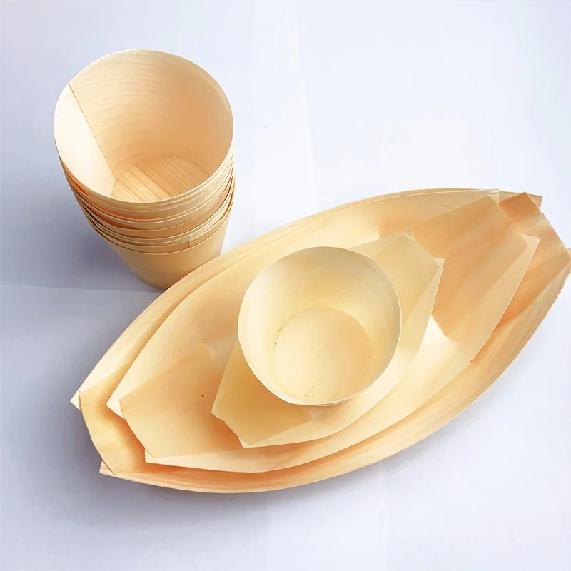 Eco-friendly disposable boat-shaped plates made from natural wood, safe and leak-proof.