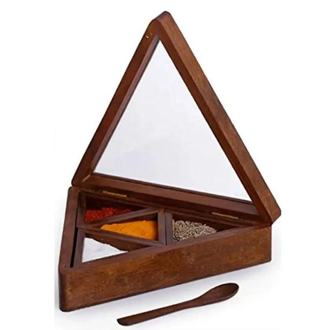 Wooden spice box in brown color with wooden spoon .