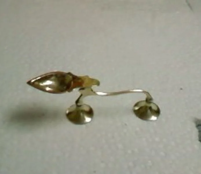 Metal decorative deepak in golden color .