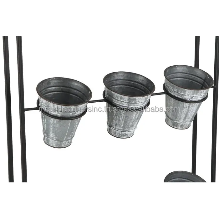 Metal 9 Galvanized planters with black metal stand holding planters for indoor and out door use