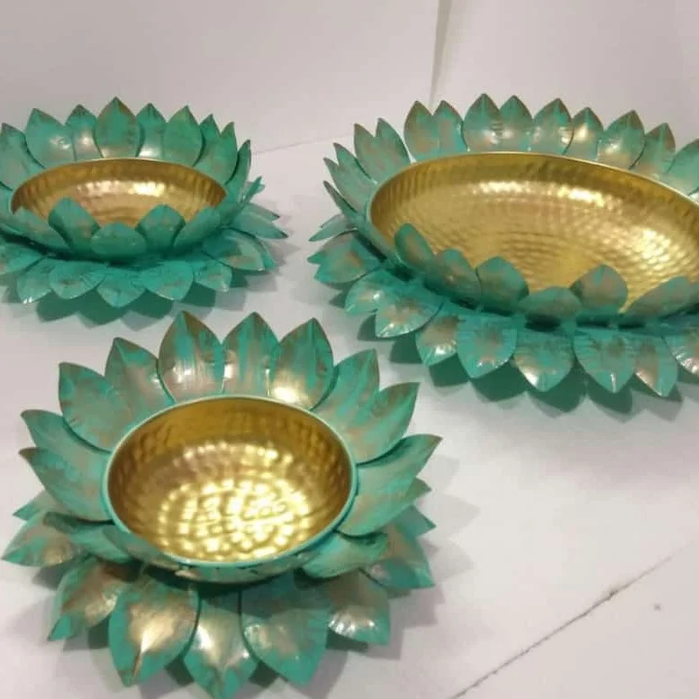 
Lotus platter in gold colour with brilliant design of lotus leaves and multiple shades of colour Diwali item new desinge 