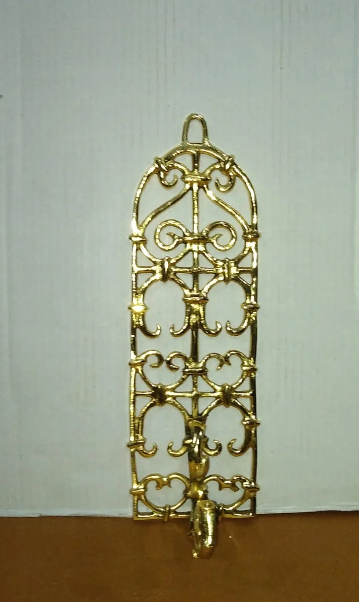 
Metal hanger in golden color in aluminum for keys cloths etc . 