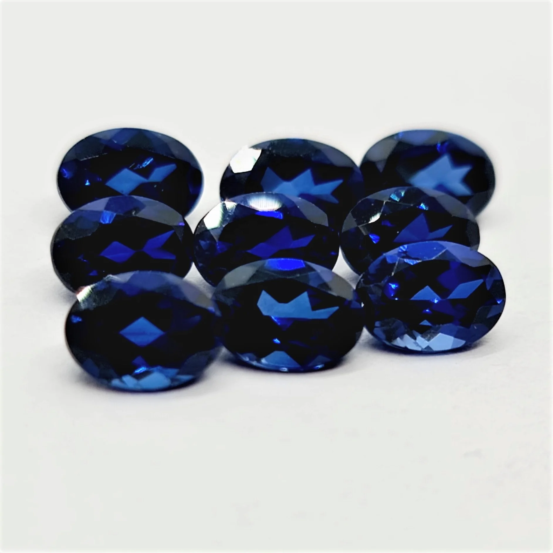 Oval Cut Lab Made Blue Sapphire Gemstone oval cut calibrated sizes and other shapes and sizes cut on order