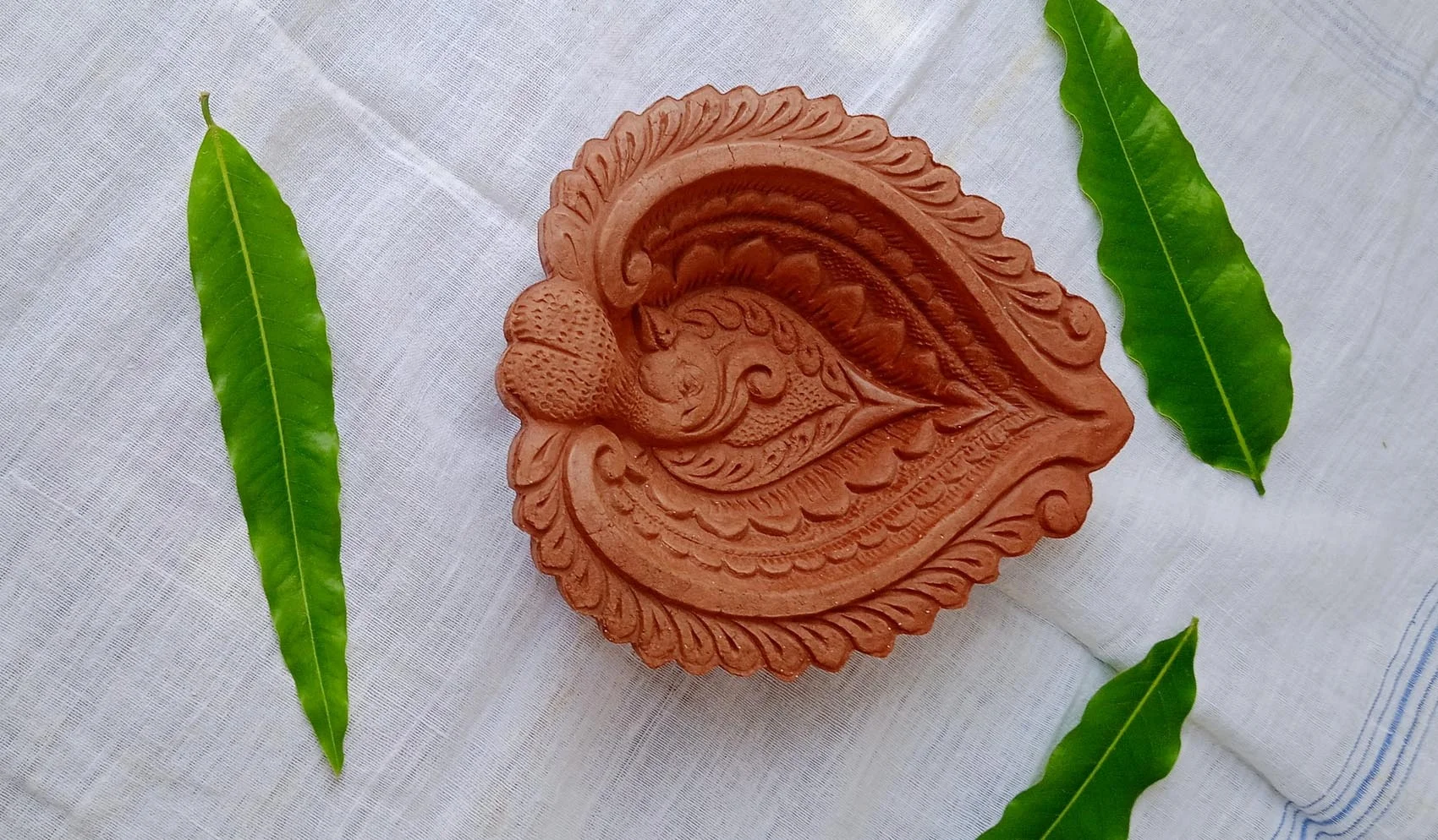 Natural clay terracotta Handmade peacock designed red clay diwali diyas oil lamps for diwali festival and rituals