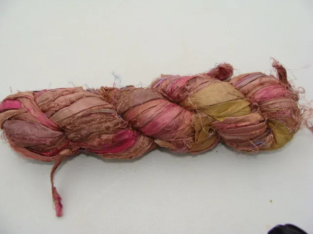 
multi coloured sari silk yarns made from recycled sari silk fibres available in 100 gram skeins suitable for knitters 