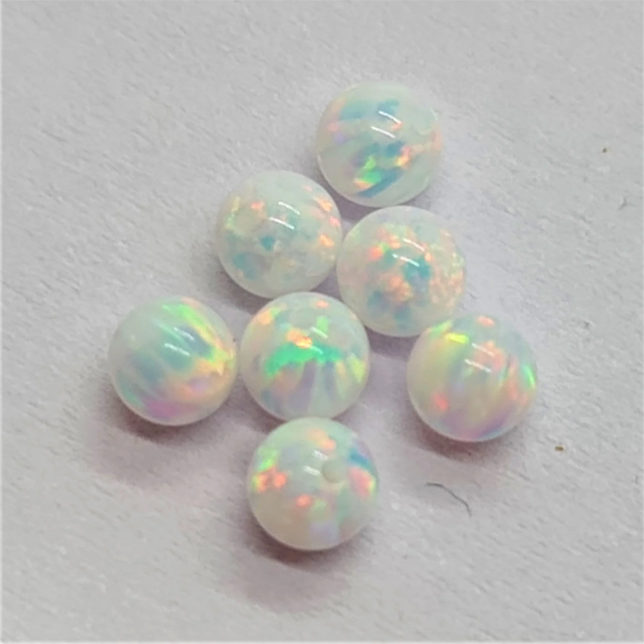 Loose Gemstone Synthetic Opal Ball Shaped Beads cut in all sizes till 15mm in other shapes and sizes as well