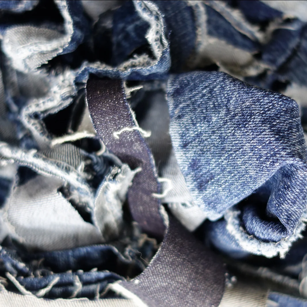 Waste denim shredded (clips / cutting) from the garment mills - Denim waste cotton piece recycling _Ms. Azura