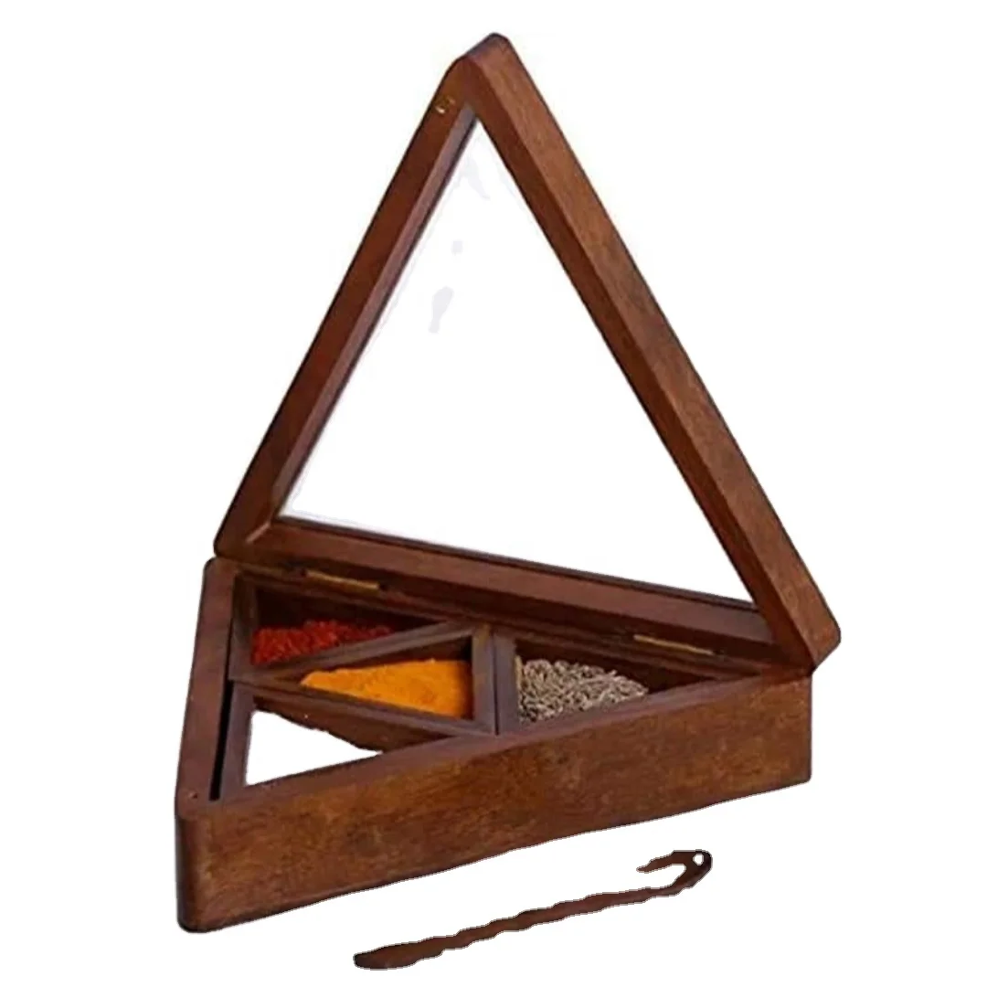 Wooden spice box in brown color with wooden spoon .