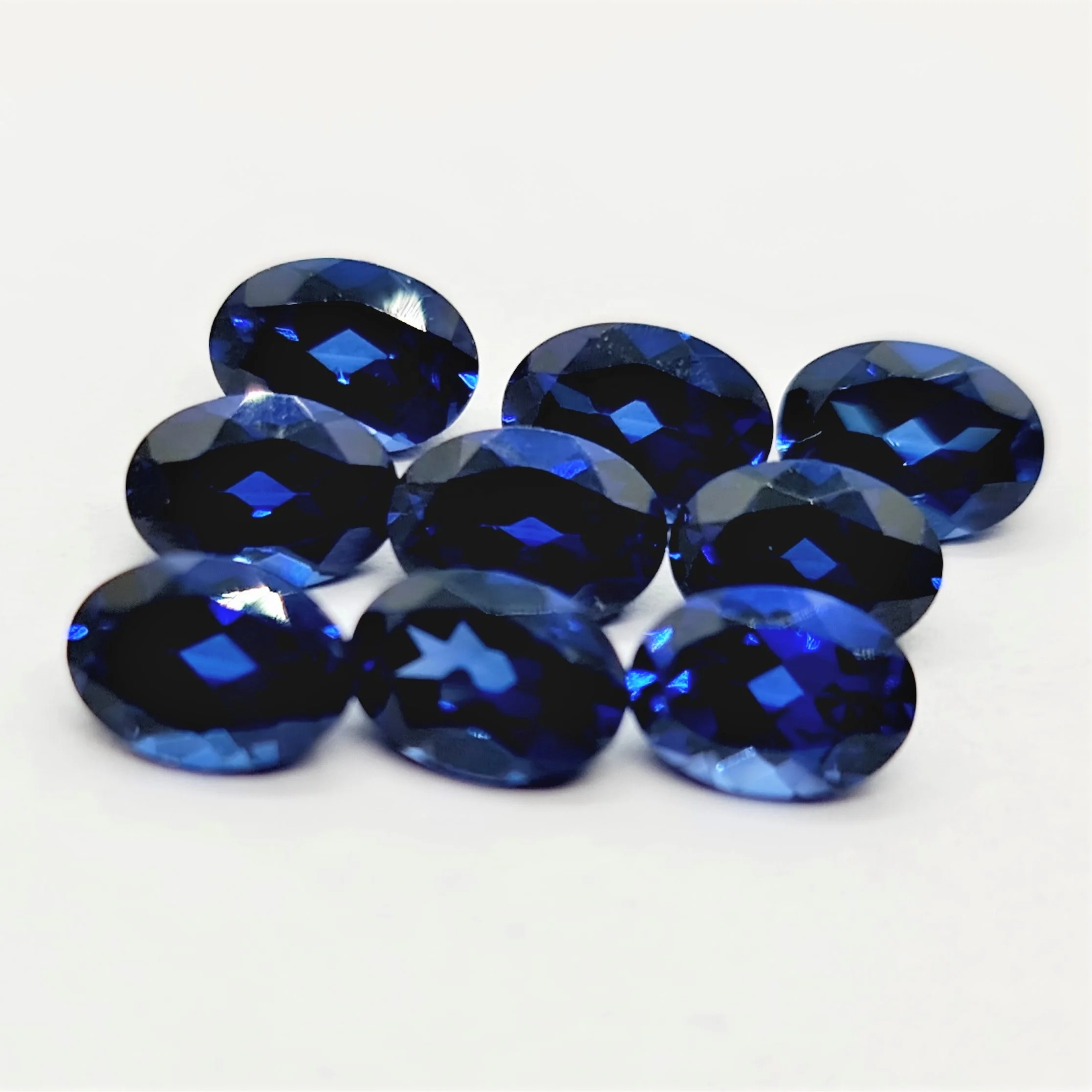 Oval Cut Lab Made Blue Sapphire Gemstone oval cut calibrated sizes and other shapes and sizes cut on order