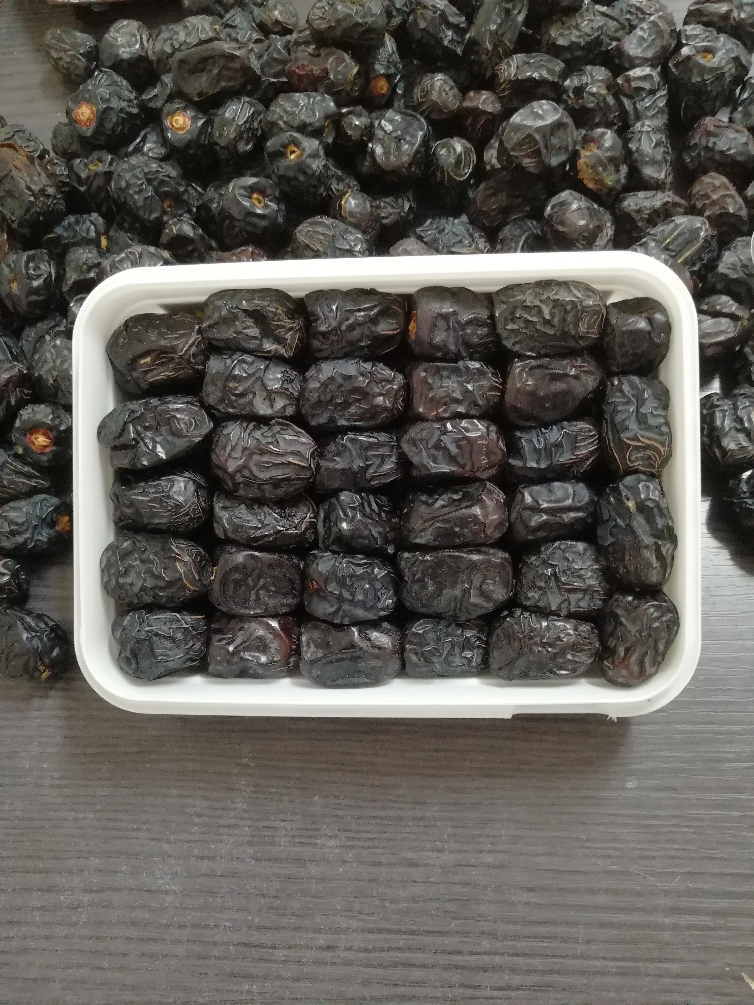 Saudi dates from Almadena Ajwa reasonable cheap price top and mixed qualities with customized packaging 500 gm 1 kg and 5 kg