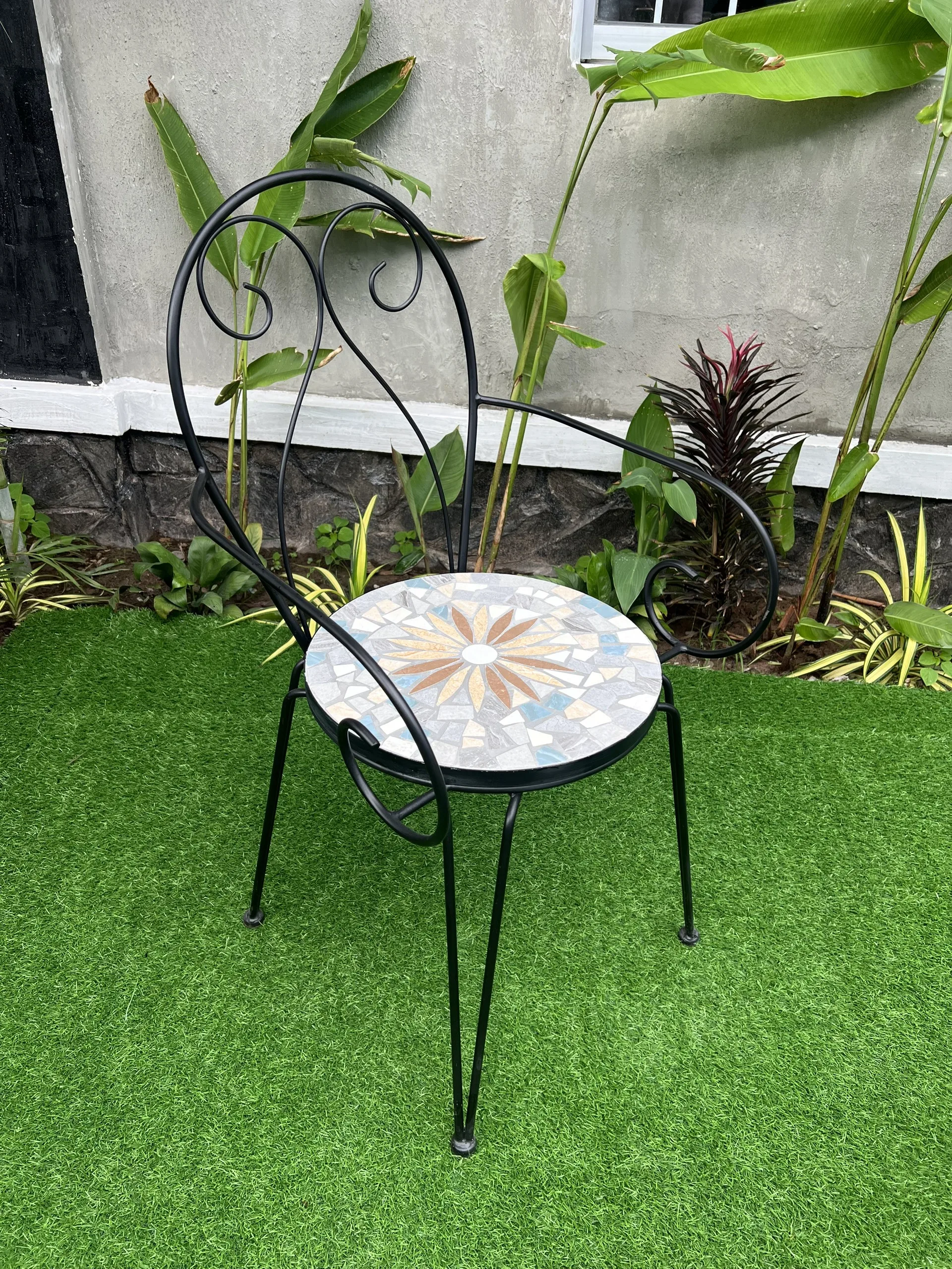 Iron chair with cement surface inlaid with unique decorative motifs, luxurious, resistant to high temperatures