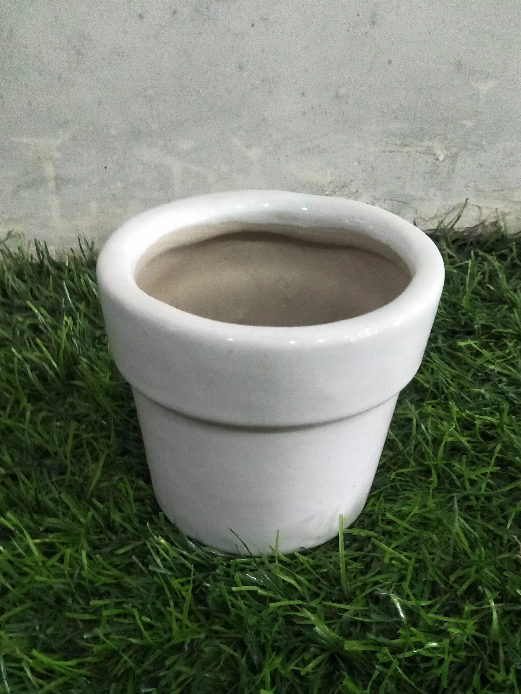 Ceramic mini planter pots for Cactus and succulents in white glaze and various colors used for indoor as well as outdoor