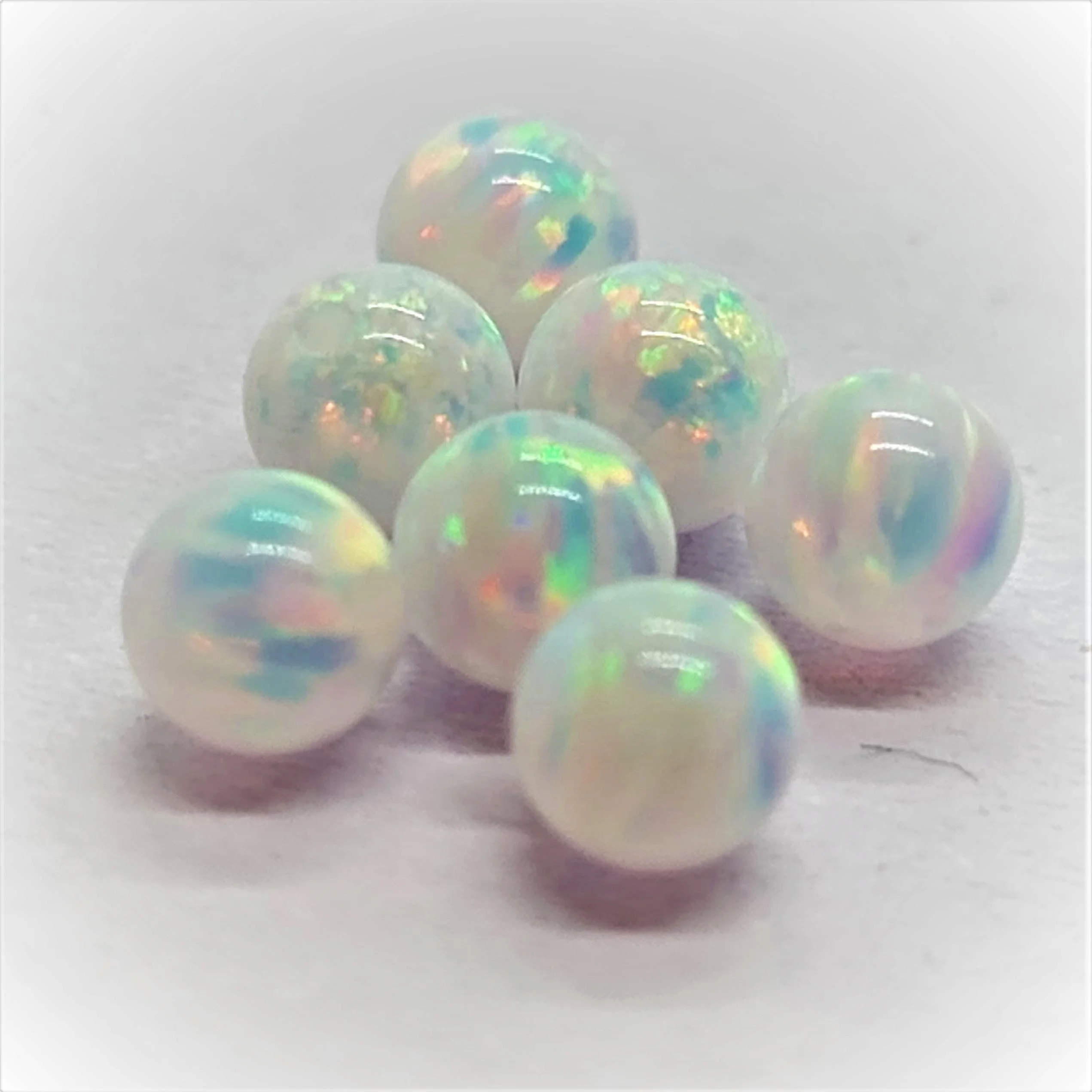 Loose Gemstone Synthetic Opal Ball Shaped Beads cut in all sizes till 15mm in other shapes and sizes as well (10000001151217)