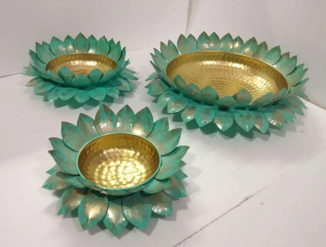 
Lotus platter in gold colour with brilliant design of lotus leaves and multiple shades of colour Diwali item new desinge 