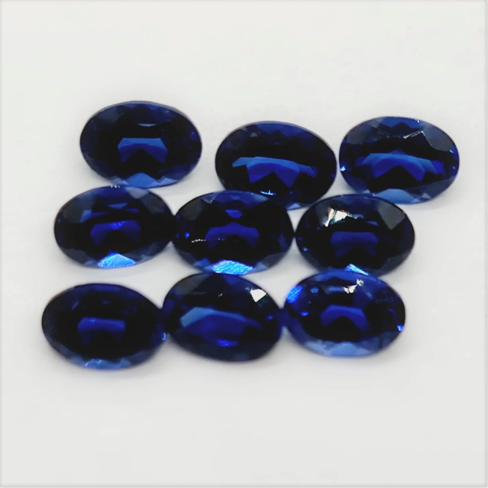 Oval Cut Lab Made Blue Sapphire Gemstone oval cut calibrated sizes and other shapes and sizes cut on order