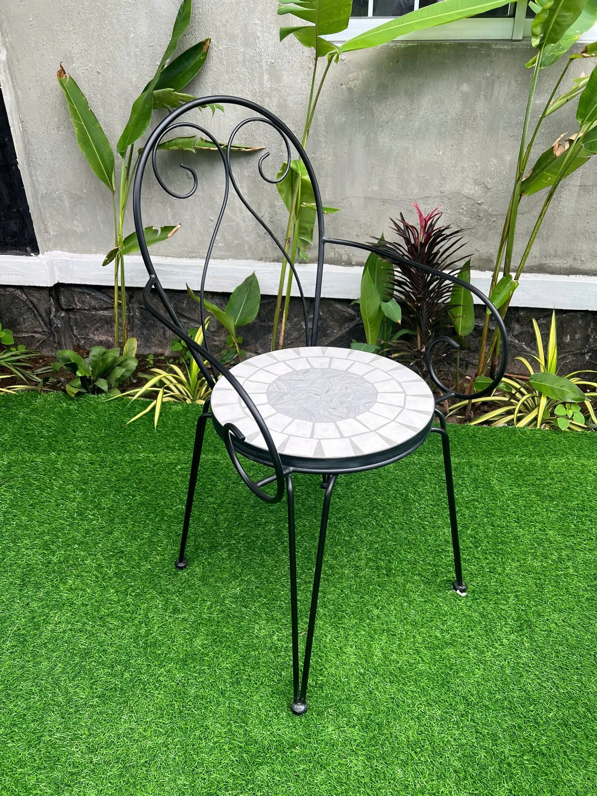 Iron chair with cement surface inlaid with unique decorative motifs, luxurious, resistant to high temperatures