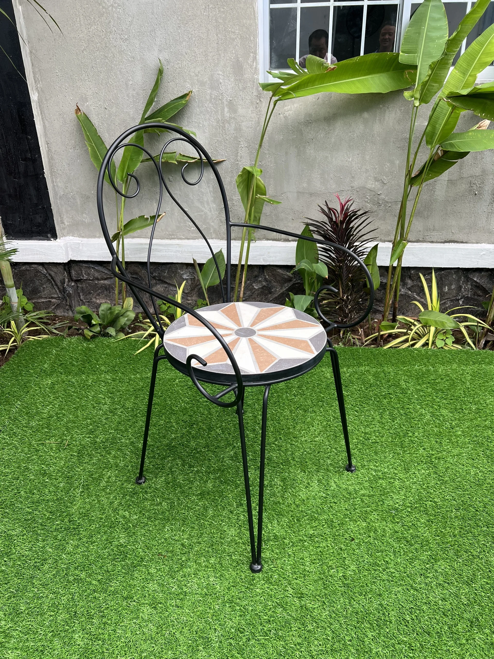 Iron chair with cement surface inlaid with unique decorative motifs, luxurious, resistant to high temperatures