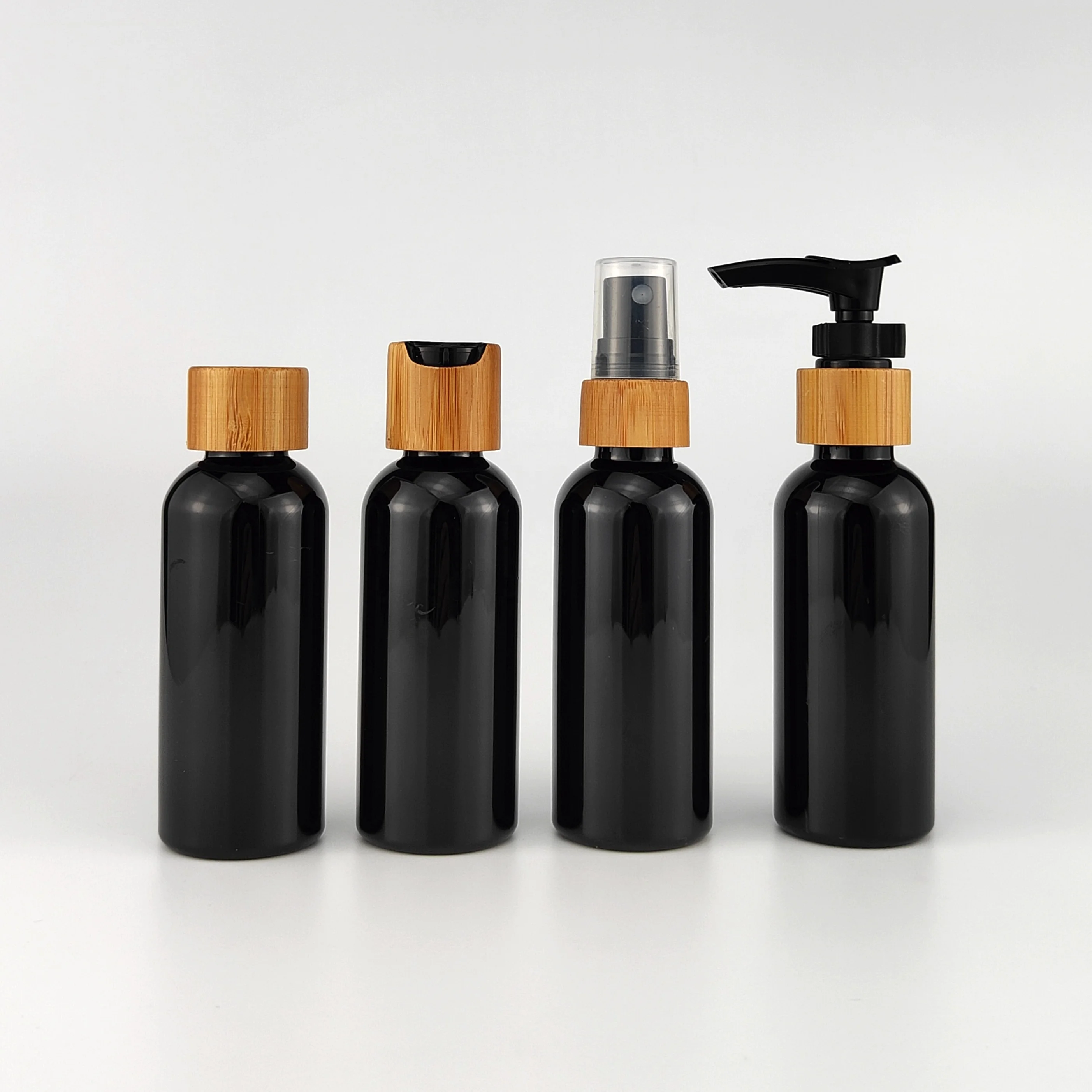 black bottle 60 ml empty 2 ounce black cosmetic bottles 50 ml plastic PET bottle with lotion pump bamboo plastic cap