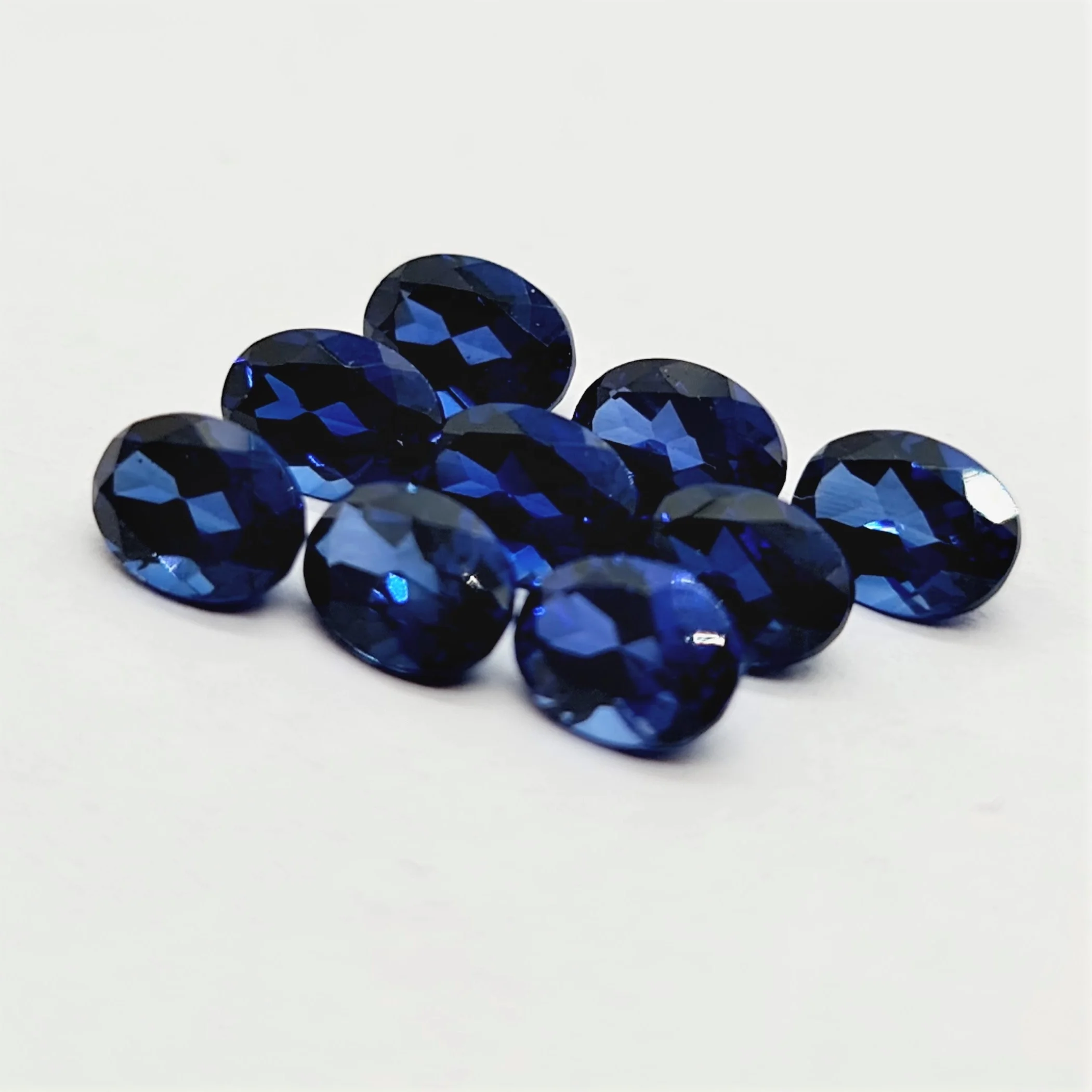 Oval Cut Lab Made Blue Sapphire Gemstone oval cut calibrated sizes and other shapes and sizes cut on order