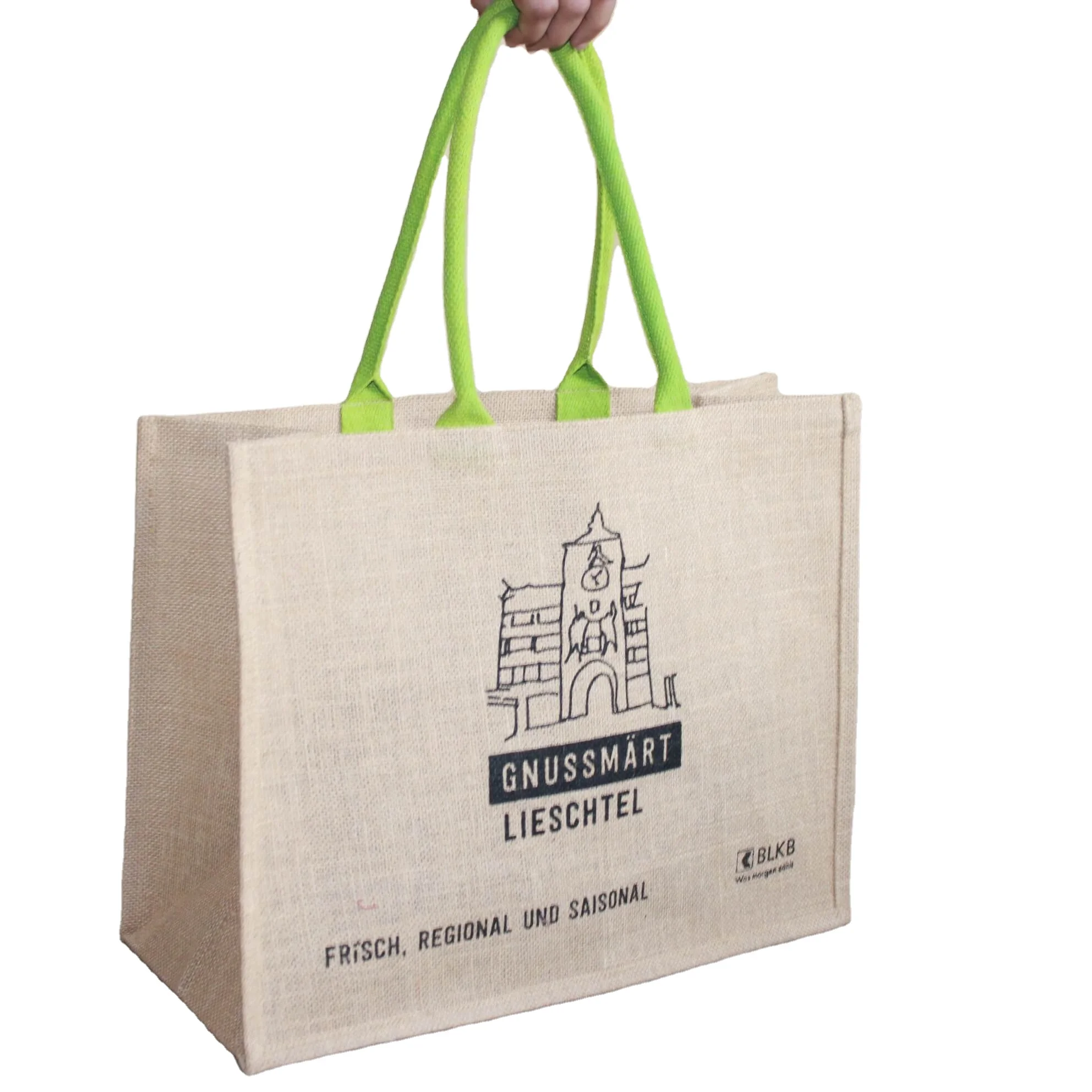 Big size burlap handbag with green strap and so much space that you can keep a large volume of goods inside