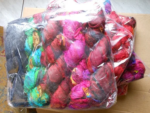 
multi coloured sari silk yarns made from recycled sari silk fibres available in 100 gram skeins suitable for knitters 