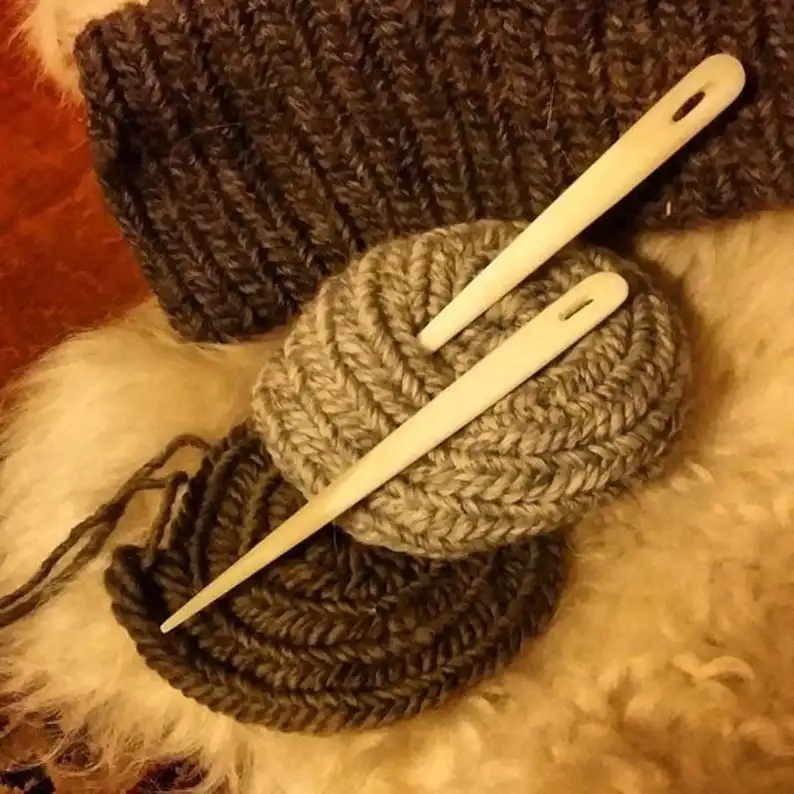 natural and historical bone needles with engraving design from viking age for using in knitting