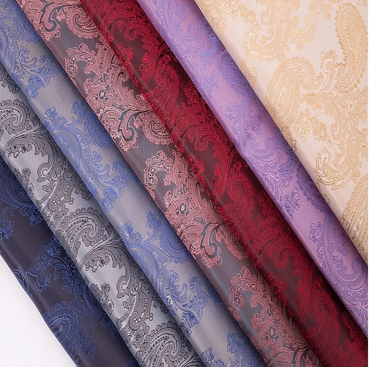 Hot sale 100% polyester jacquard taffeta fabrics paisley pattern soft lining fabric for garment