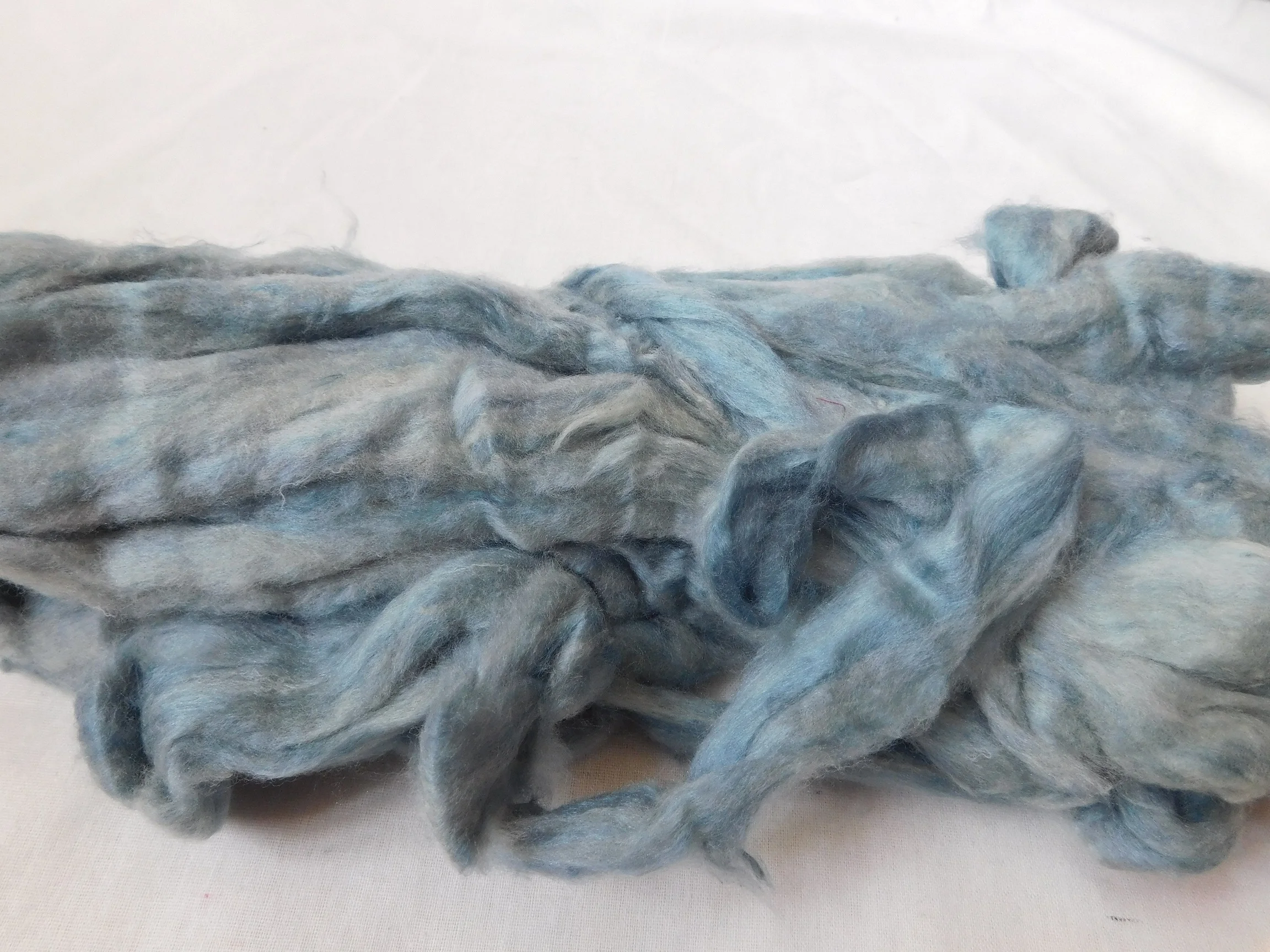 sari silk roving in two tone custom dyed colors suitable for yarn and fiber stores made from recycled silk fiber