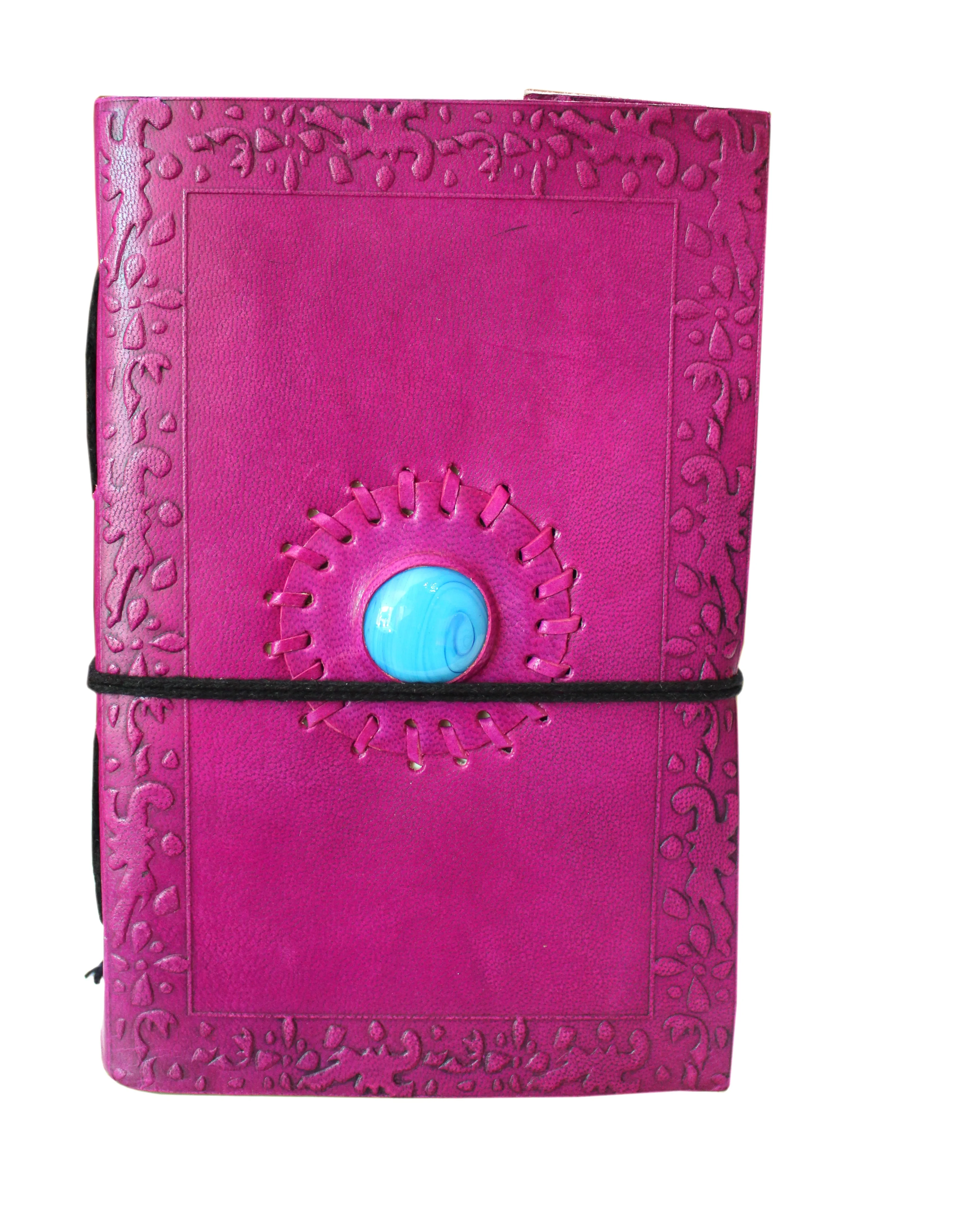 Leather journal pink color embossed design center sky color stone with black cotton thread closer diary