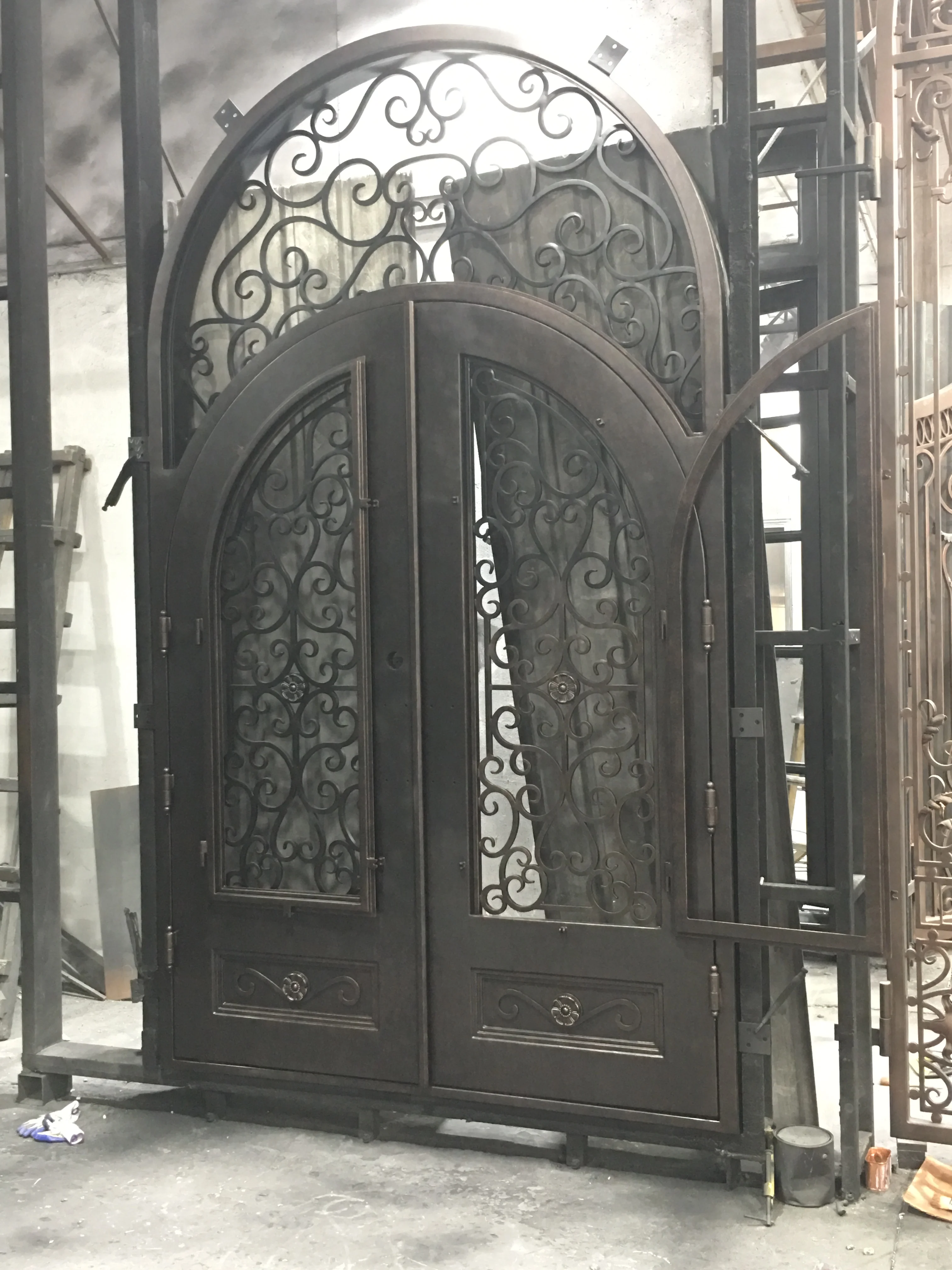 arched double wrought single iron entry doors