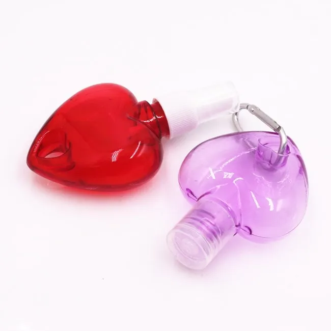 wholesale 50ml empty heart shape plastic PETG HDPE hanging hand sanitizer spray bottle with hook keychain bottles