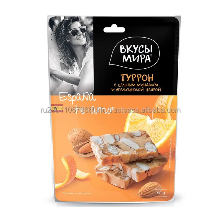 Вкусная здоровая закуска нуга с жареным миндалем и апельсиновой цедью много аскорбиновой кислоты витамина А
