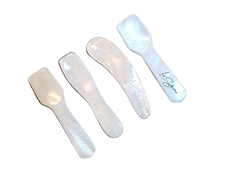 A collection of pretty little spoons made from white pearls for cosmetic use or  tasting caviar provided by Vietcrafts