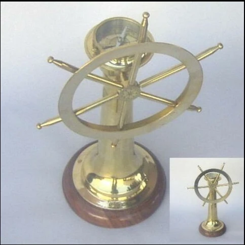 brass compass on wooden box