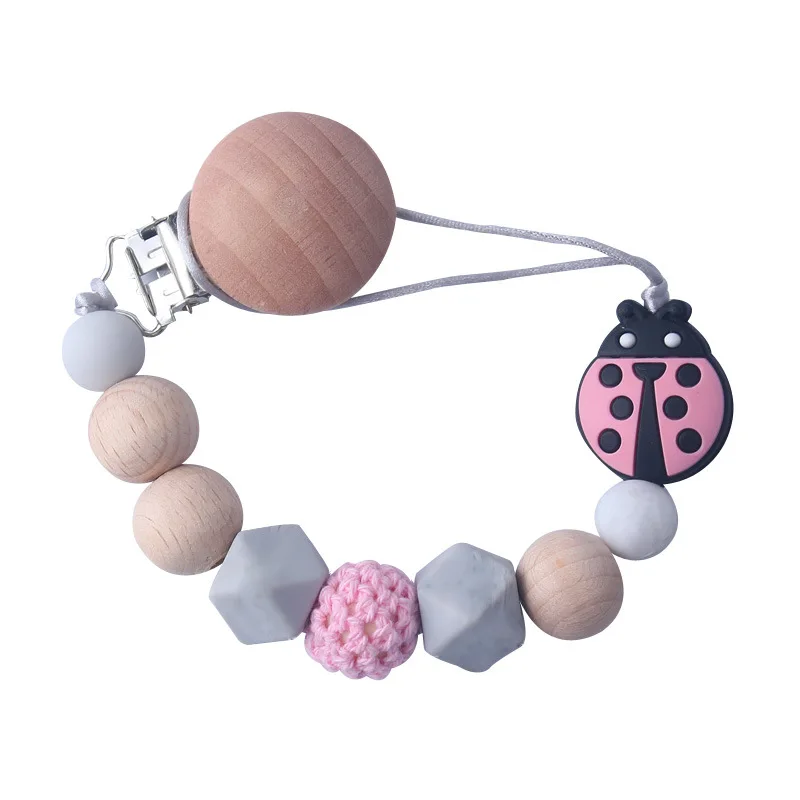 Wholesale Pink Insect Ladybug Beech Wood Infant Soft Silicone Wooden Soother Round Silicone Baby Dummy Clip Pacifier Clip